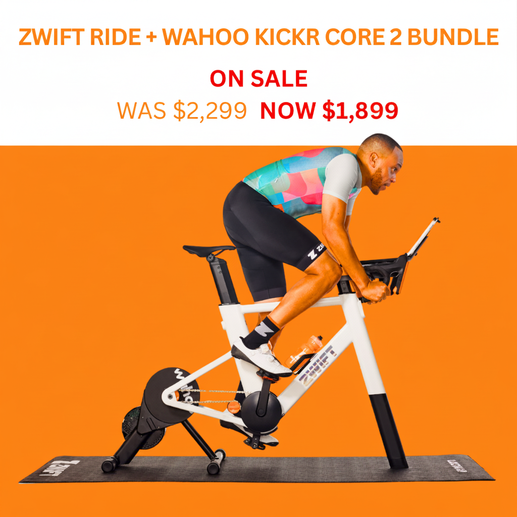 A man riding a white and black Zwift indoor bike on a black trainer with an orange background and promotional text at the top reading 'ZWIFT RIDE + WAHOO KICKR CORE 2 BUNDLE ON SALE WAS $2,299 NOW $1,800'.